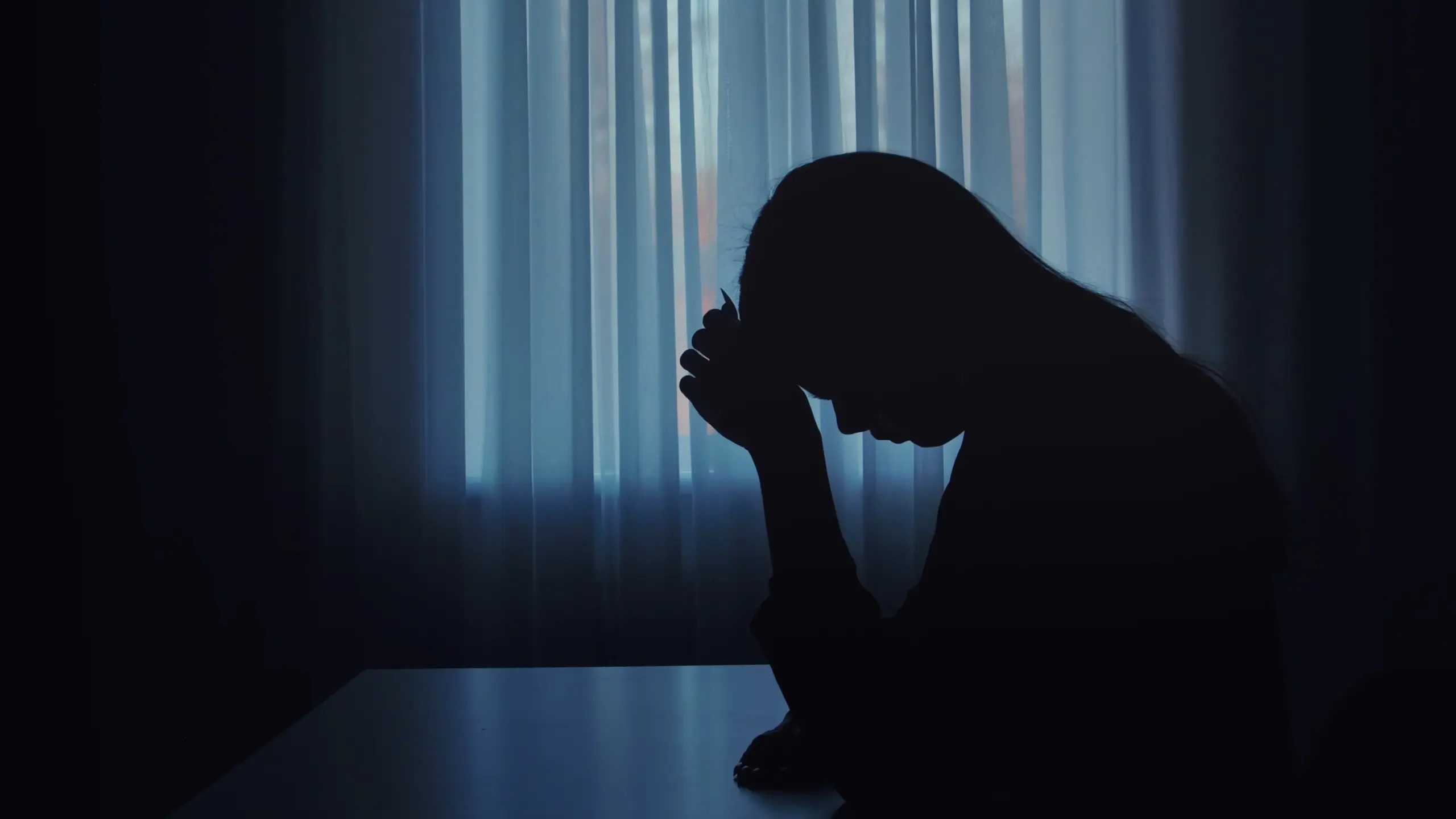Person experiencing isolation and emotional struggle