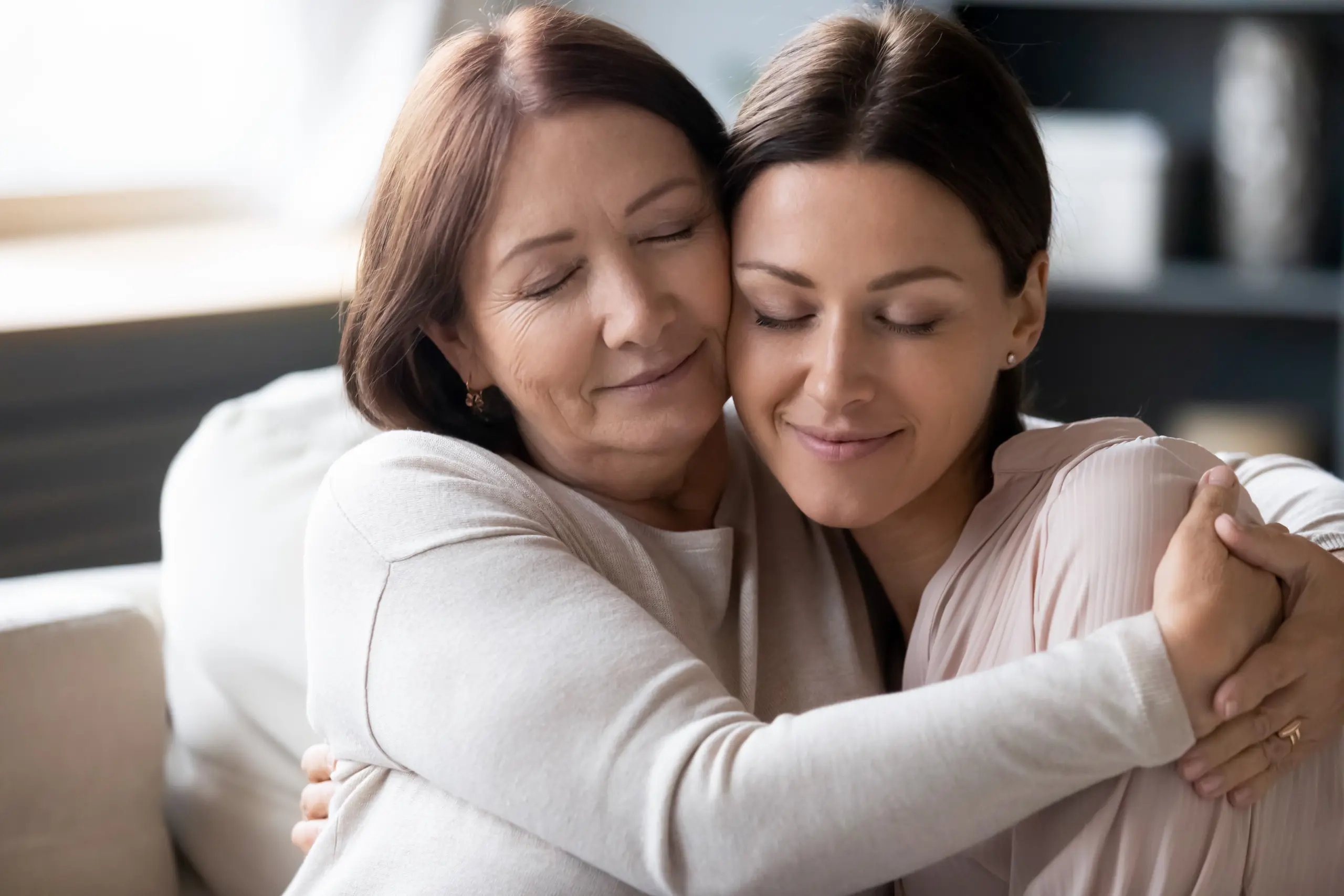 Loved one embracing family after agreeing to treatment