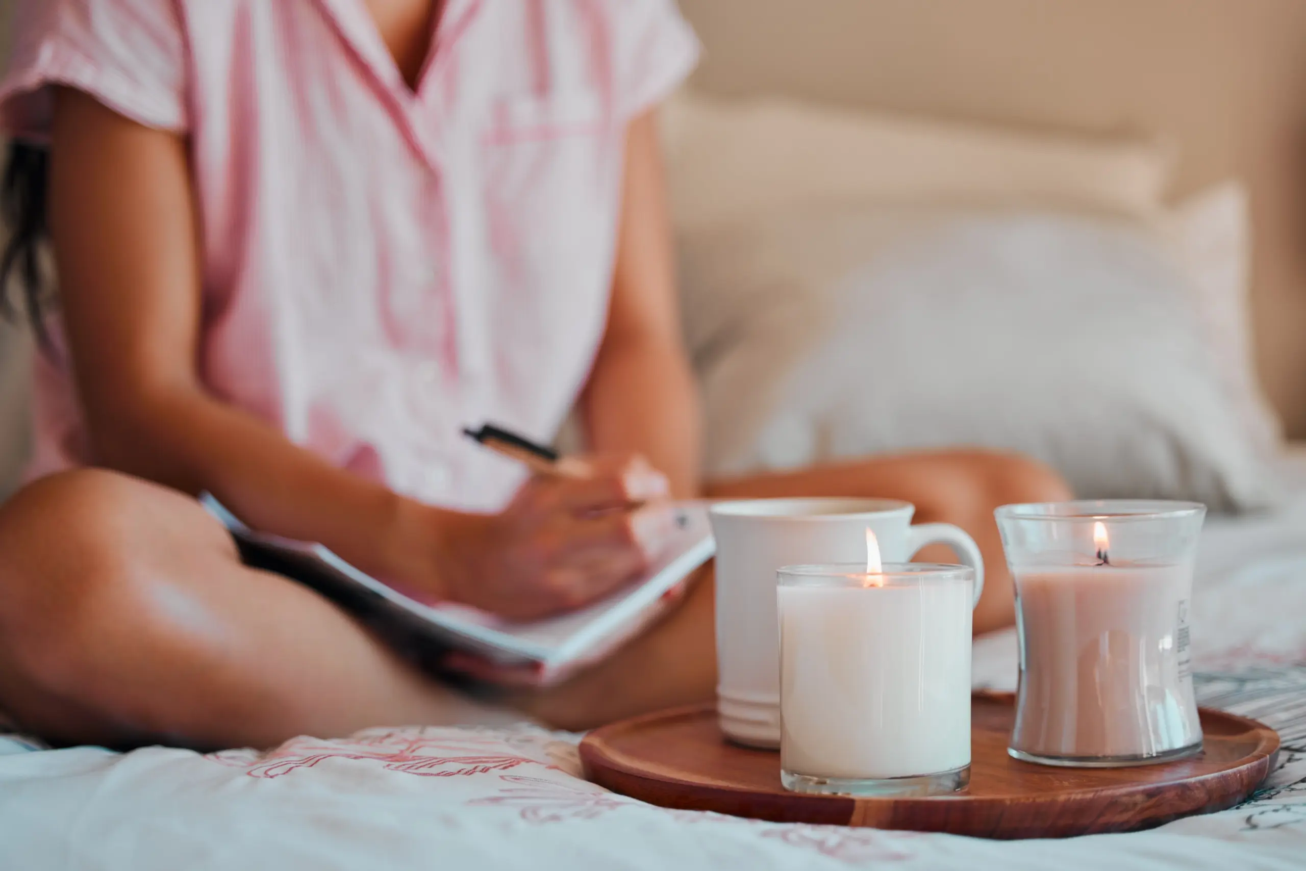 Person journaling to apply mindfulness in addiction and mental health recovery